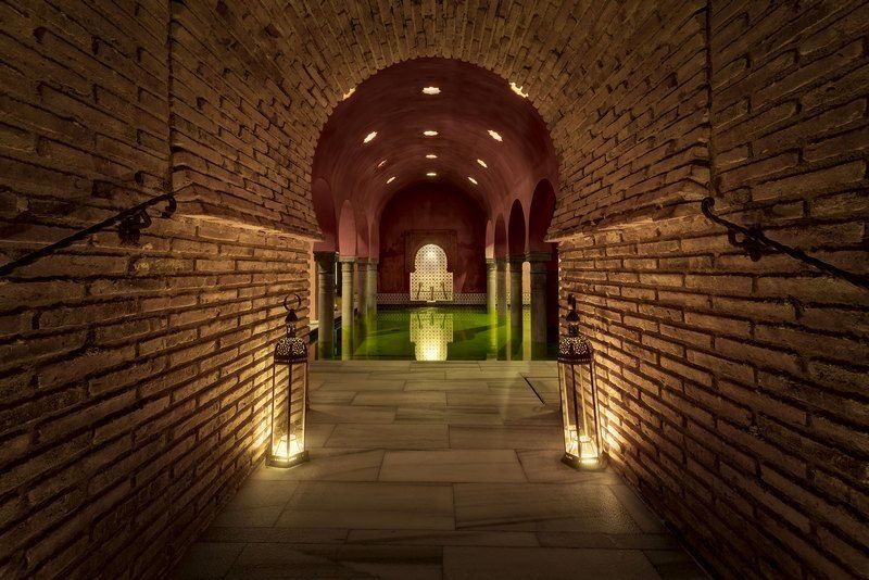 Granada: Alhambra Guided Tour and Arabian Bath and Massage - The Route Through Nasrid Palaces, Charles V, and the Fortress
