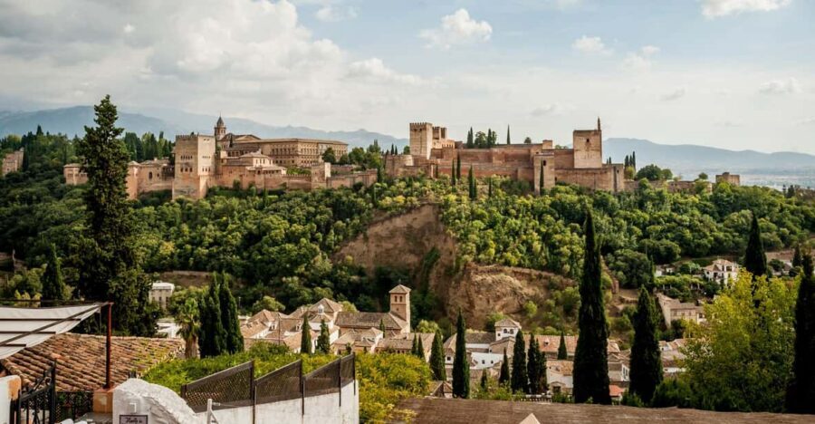 Granada: E-Bike Tour and Fast-Track Alhambra Ticket - Sacromonte cave houses, flamenco venues, and big Sierra Nevada views